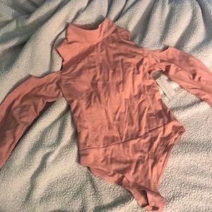 Open shouldered long sleeved body suit